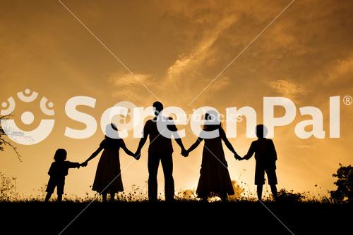 Silhouettes Of Happy Parents Having Fun With Their Children
